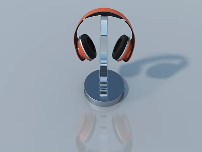 Orange Over Ear Headphones Placed On Chrome Metal Stand With Reflective Surface 3d model