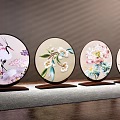 Four Piece Chinese Embroidered Round Decorative Ornament Set with Floral Bird Patterns