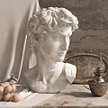 Classical Marble Bust Sculpture On Wooden Table With Textured Wall Cloth Eggs And Metal Tray