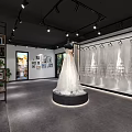 Modern Bridal Shop Interior With Wedding Dress Display Picture Frames Green Plants And Sofa