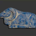 Blue Ram Sculpture With Carved Details And Textured Surface On Dark Base