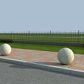 Outdoor Road Facilities Featuring Stone Spheres Brick Pavement And Black Iron Fence