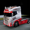 Sleek Volvo VNL Truck With Red Silver Exterior Moving On Road At Night