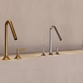 Stylish Faucets with Different Finishes on Light Gray Countertop and Beige Wall