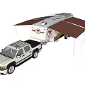 White Pickup Truck Towing Eagle Travel Trailer With Extended Awning