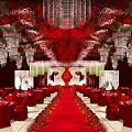 Red Theme Banquet Hall With Chandeliers Red Carpet Flower Decorations And Wedding Setup