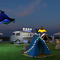 Outdoor Camping Event With Lighted Tents Food Truck And Decorative Umbrella Lights On Grass