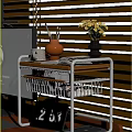 Metal Frame Wooden Top Storage Shelf with Orange Pottery Jar Yellow Flowers and Books
