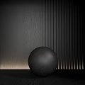 Softly Illuminated Black Sphere On Flat Surface With Wood Grain And Striped Wall
