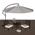 Comfortable Outdoor Chairs with Cushions on Wooden Deck and Patio Umbrella with Small Round Table