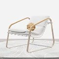 Modern Leisure Chair With Gray Cushion Wooden Armrests Metal Frame And Knotted Decor On Rug
