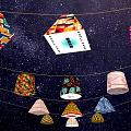 Colorful Geometric Lantern Art Installation Suspended On Strings Against Starry Sky Background