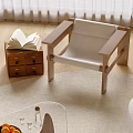 Cozy Leisure Chair With Wooden Frame Beige Cushion Open Book On Cabinet And Wooden Floor