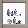 Decorative Blue and White Ceramic Vessels of Various Sizes on Display Shelf