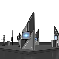 Modern Exhibition Booth With White Stands Digital Screens Lighting And People In White Clothing