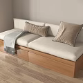 Cozy Modern Sofa With Beige Cushions Wooden Base Pillows And Blanket