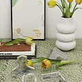 White Stacked Vase With Yellow Tulips Frank Book And Abstract Art On Tabletop