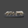Three Silver Bull Sculptures On Black Circular Platform With Dark Background