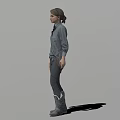Game Movie Character Female Standing In Gray Shirt Dark Pants And Boots With Shadow