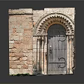 Ancient Stone Doorway with Arched Top and Carved Columns in Medieval Wall