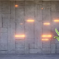 Stone Background Wall With Irregular Square Panels Orange LED Strip Lights And Large Green Plant
