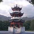 Ancient Chinese Multi Tiered Tower With Red Wooden Pillars Black Tiled Roof And Mountain Backdrop