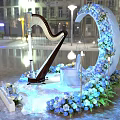 Stunning Harp Display With Blue Floral Wreath Ice Sculpture Seat And Night Building Lighting