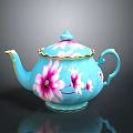 Blue Teapot With Pink Floral Patterns And Gold Accents On Lid And Handle