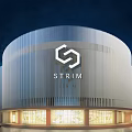 Modern STRIM Building Exterior With Hexagonal Logo And Illuminated Striped Curved Facade