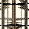 Woven Rattan Room Divider With Beige Panels And Black Frame Design