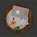 Daily Necessities Arranged On Wooden Round Side Table With Tray And Small Bottle