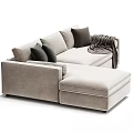 L shaped Sectional Sofa in Neutral and Green Tones with Multiple Decorative Cushions and Gray Throw Blanket