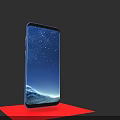 Modern Blue Smartphone Displaying Starry Sky Mountain Wallpaper On Red Platform