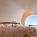 Modern Hotel Room With Arched Window Sea View White Bedding And Wooden Headboard
