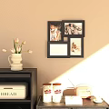 Decorative Black Photo Frames Arranged On Beige Wall With Vase Flowers Vintage Radio And Cabinet