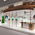 Elegant Luxury Hermes Shop Window Display With Green Dress And Green Items On Display Stands