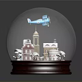 Snow Globe With Small Houses Tower Airplane And Snowflakes On Wooden Base