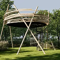 Modern Wooden Observation Deck With Spiral Staircase In Lush Green Park Setting