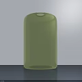 Light Green Glass Cylindrical Vase With Smooth Glossy Surface On Gray Background Wall