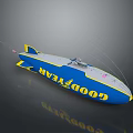 Goodyear Blimp Model Featuring Blue White Yellow Accents Antennas and American Flag