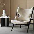 Sheepskin Accent Chair With Black Wooden Frame Small Round Side Table White Vase