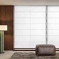 White Roman Shades In Modern Interior With Wooden Wall Floor Lamp And Leather Ottoman