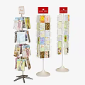 Various Design Brochure Display Stands With Black Tripod And White Bases Holding Flyers