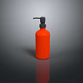 Sleek Orange Pump Bottle With Black Dispenser For Daily Household Use On Dark Surface