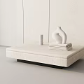 Modern Minimalist Coffee Table with Light Top Sculptural Vase Stack of Books and Small Cylinder in Interior