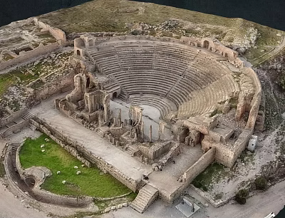 Ancient Amphitheater Ruins Scenic Landscape With Stone Seats And Mountain Backdrop 3d model