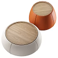 Two Modern Round Coffee Tables With Wooden Tops And White Orange Bases