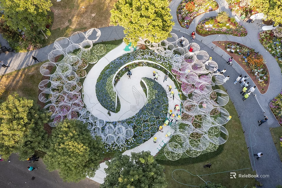 Scenic Park Landscape With Spiral Path Flower Beds Greenery And Circular Decorative Structures 3d model 