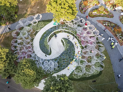Scenic Park Landscape With Spiral Path Flower Beds Greenery And Circular Decorative Structures 3d model