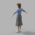 A woman in blue shirt and gray skirt with arms outstretched standing against gray background